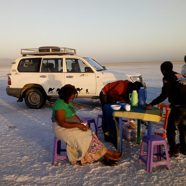 Tourists eating lunch at portable table in the Denakil Depression